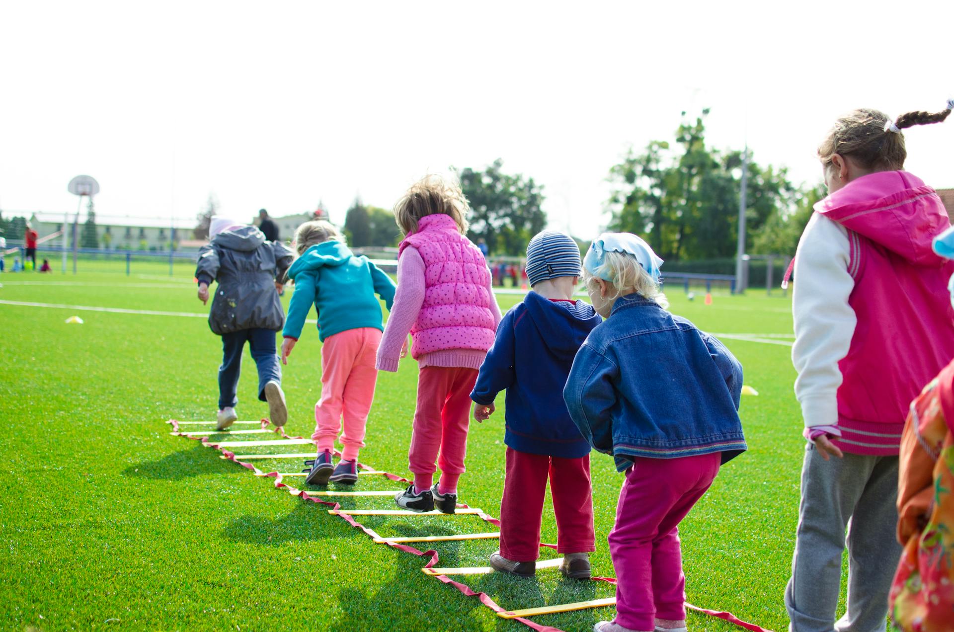 Children’s team building on green grass