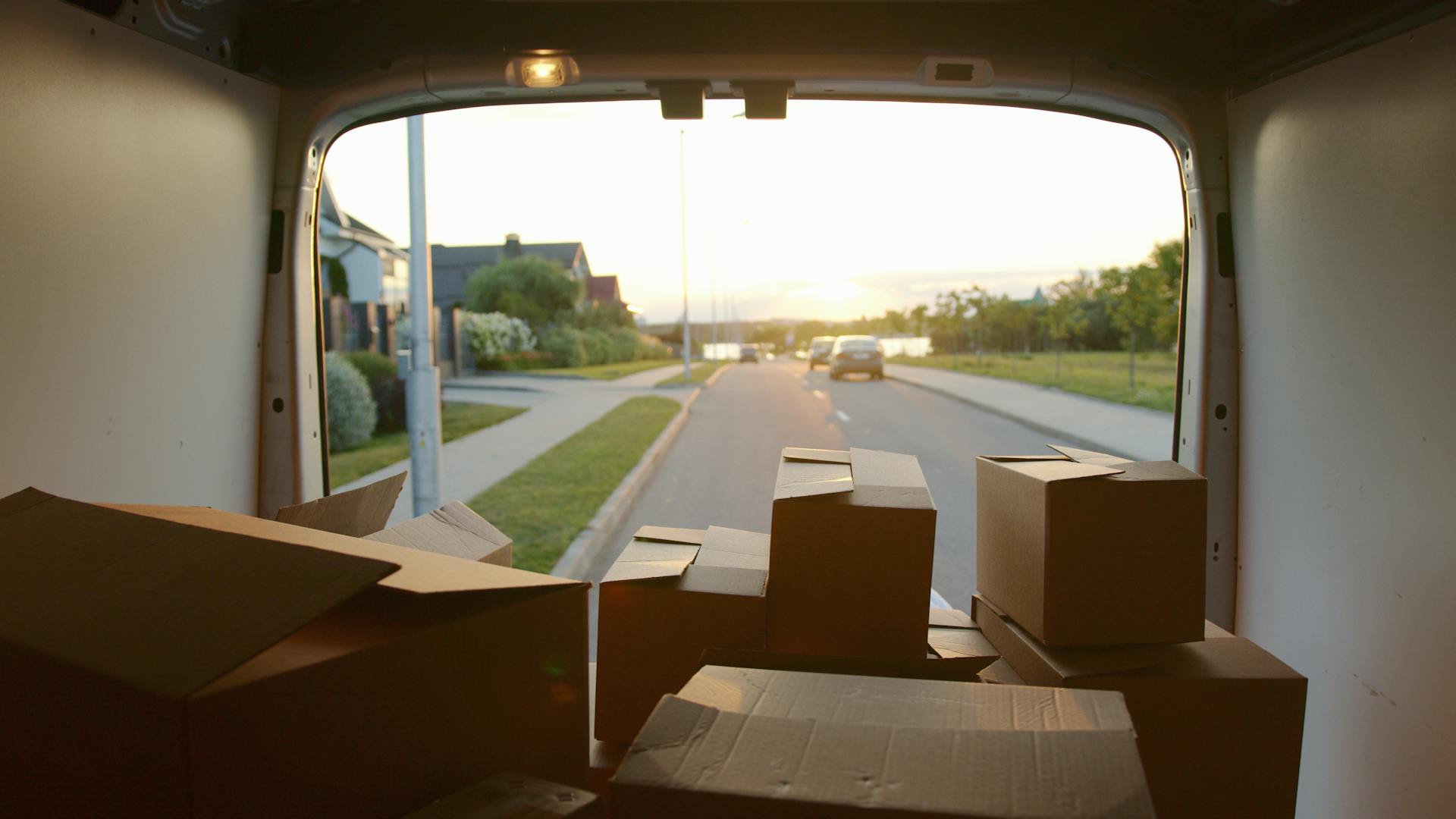 Brown cardboard boxes inside a van